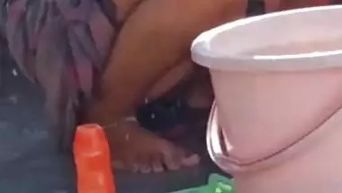 Dehati Bhabhi bathing topless on the terrace