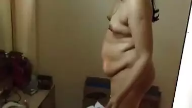 Paunchy Desi woman with small tits shows her body in the porn video